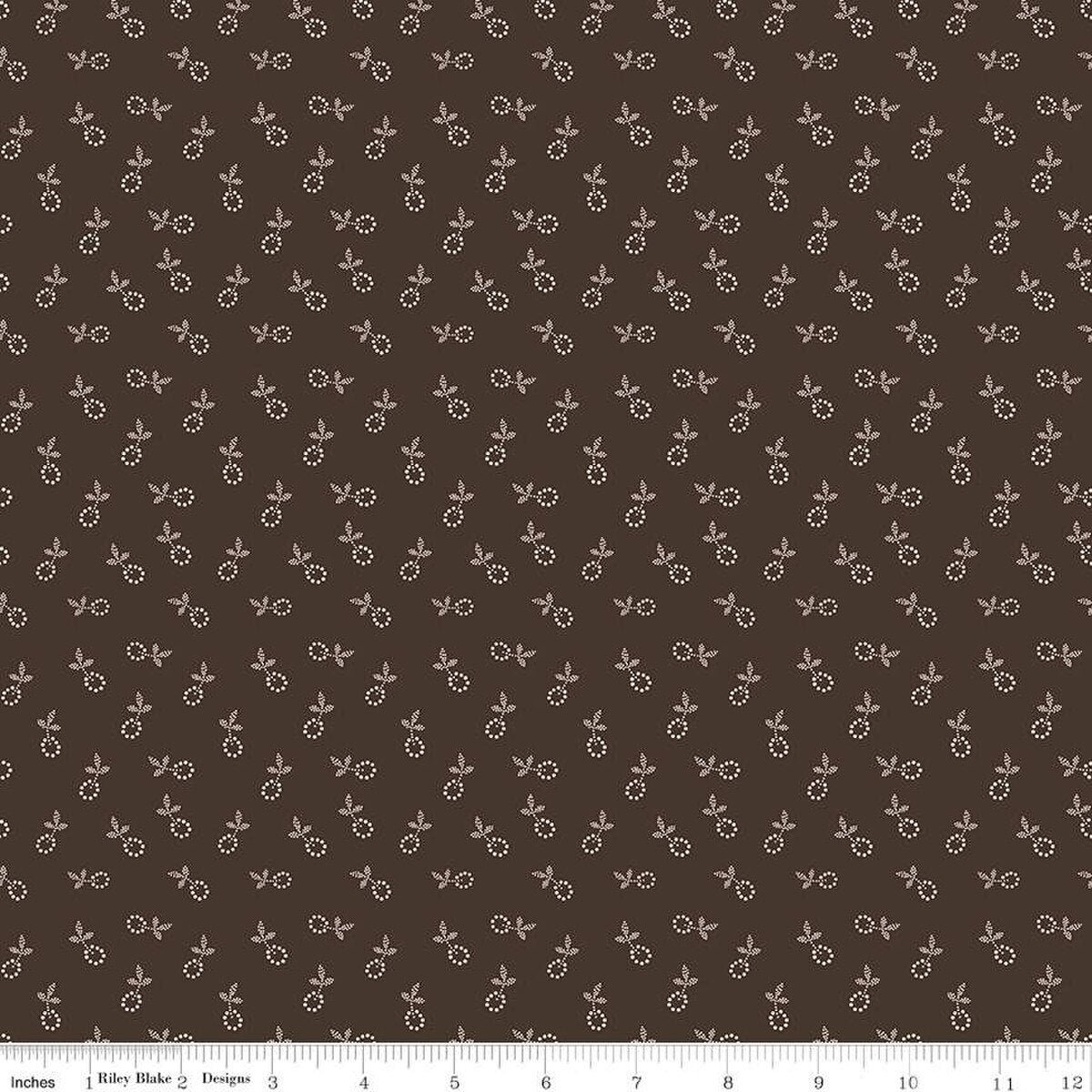 Fabric with small floral pattern on a brown background