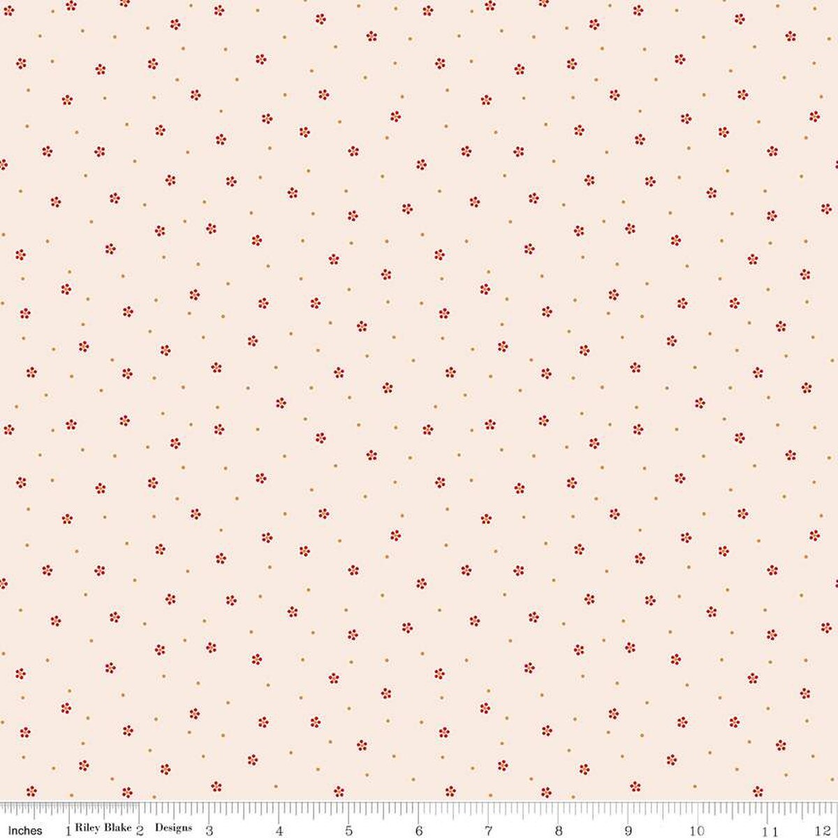 Floral patterned fabric with small red flowers on a beige background