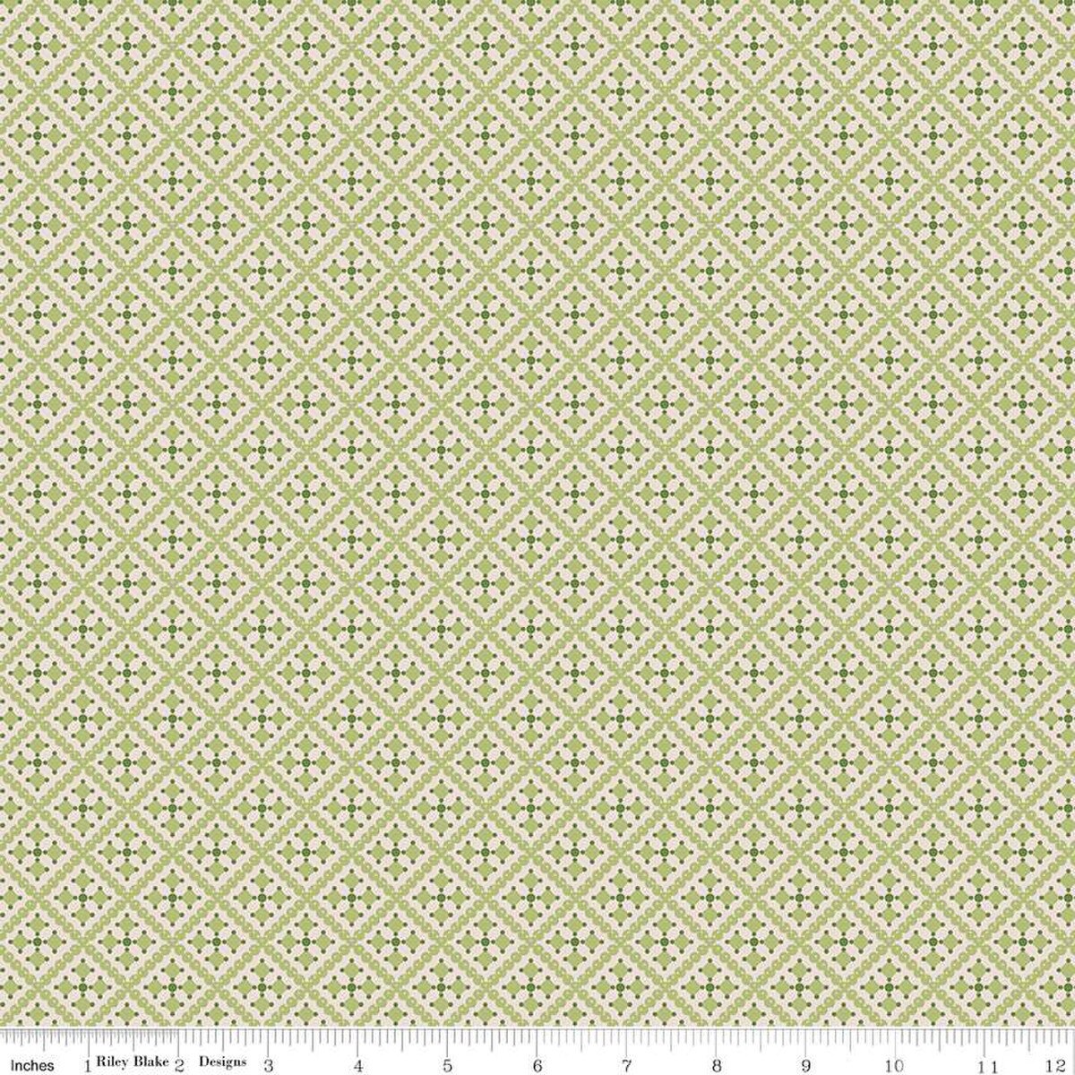 Patterned fabric with a geometric design on a light green background