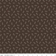 Fabric with small floral pattern on a brown background