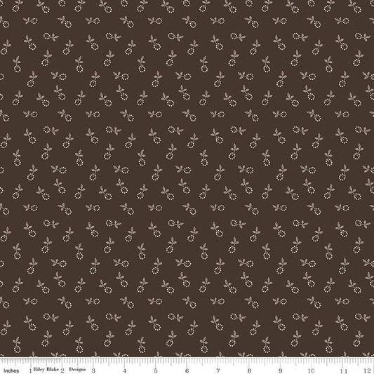 Fabric with small floral pattern on a brown background