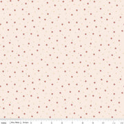 Floral patterned fabric with small red flowers on a beige background