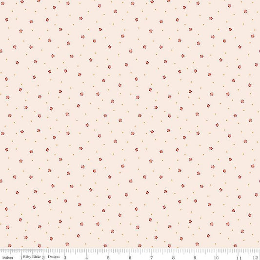 Floral patterned fabric with small red flowers on a beige background