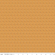 Fabric with small flower pattern on a mustard yellow background