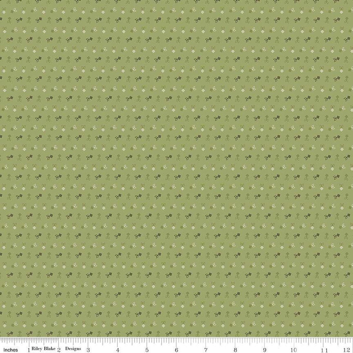 Green fabric with small white and brown flower pattern
