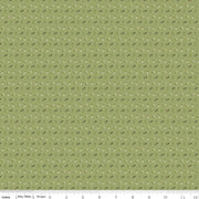 Green fabric with small white and brown flower pattern