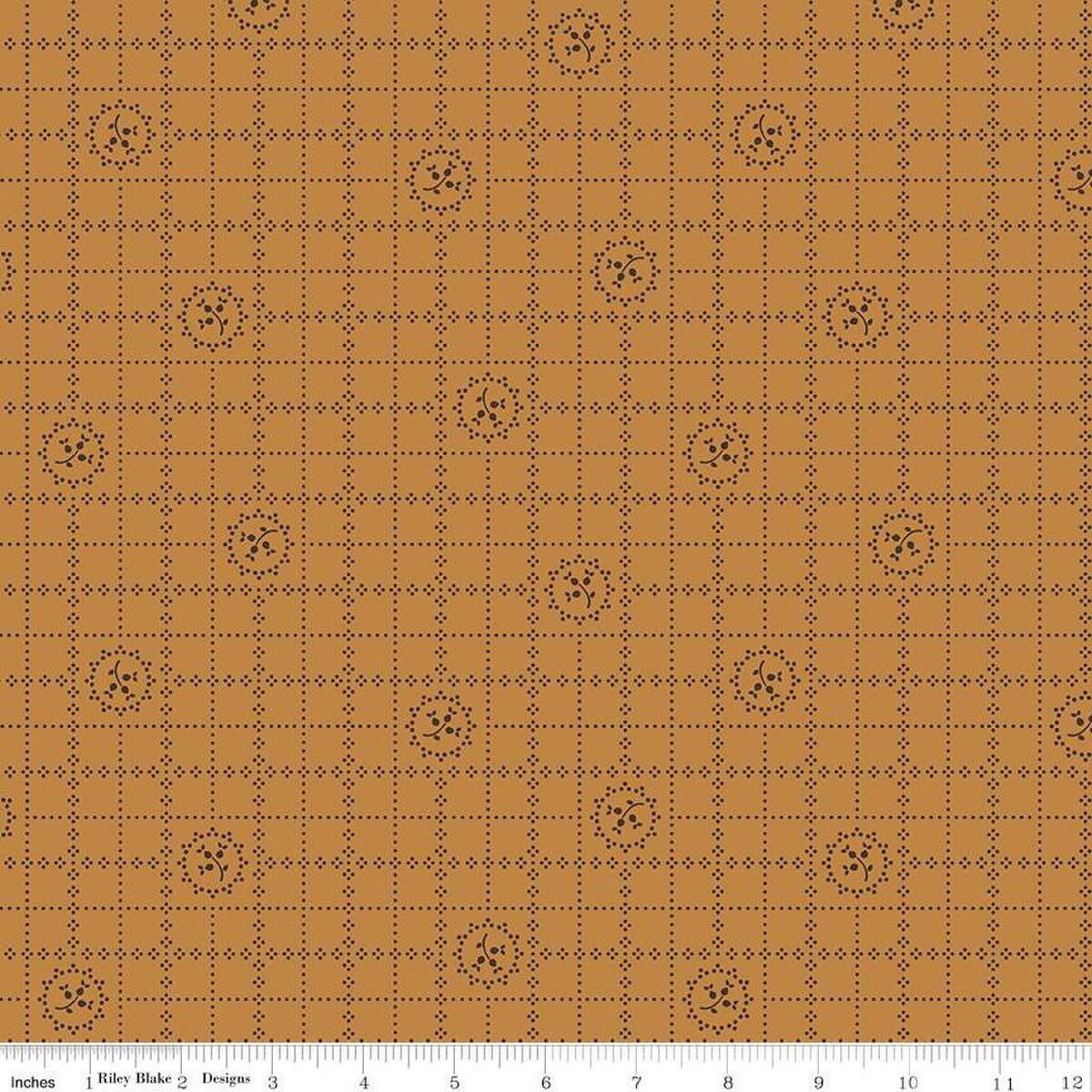 Fabric pattern with brown grid and geometric shapes on a brown background