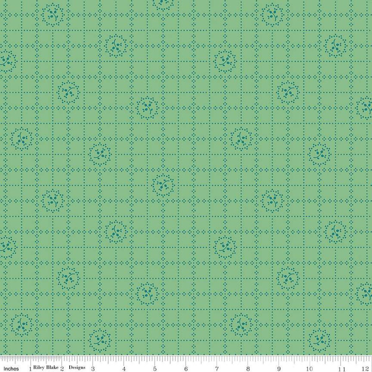 Green fabric with a grid and floral pattern