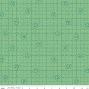 Green fabric with a grid and floral pattern
