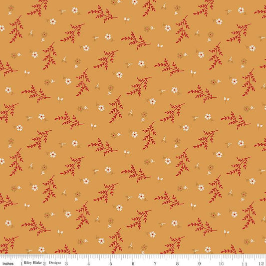 Floral pattern fabric with red and white flowers on a mustard yellow background