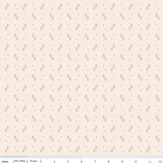 Fabric with small green geometric pattern  on a beige background.