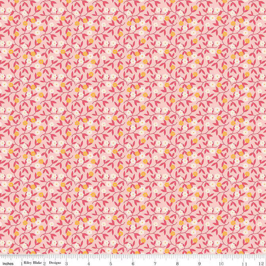 Floral pattern fabric swatch on a pink background.