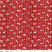 Red fabric with small white and pink flowers pattern