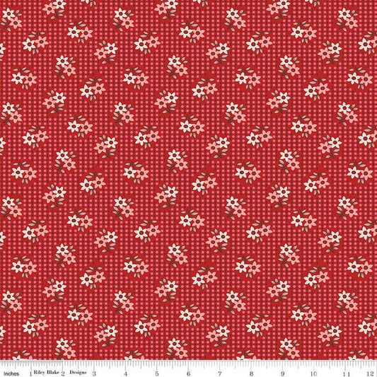 Red fabric with small white and pink flowers pattern