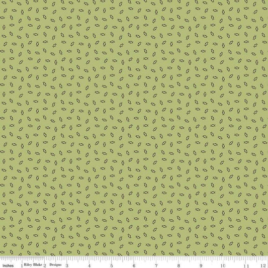 Green fabric with small blue and brown pattern.