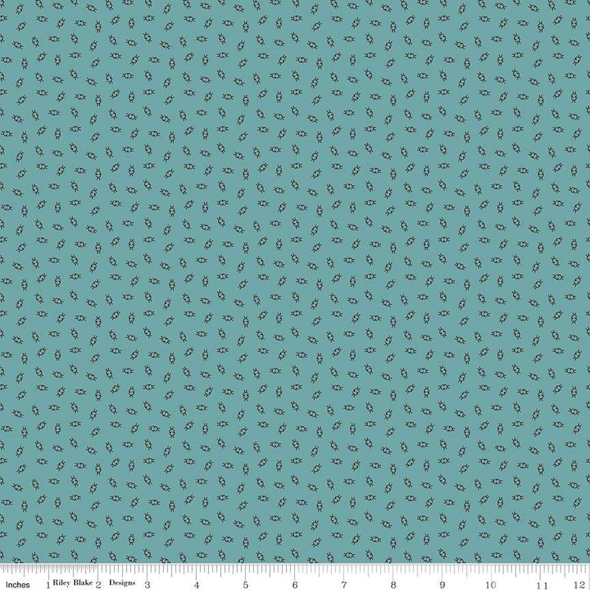 Teal fabric with small pattern.