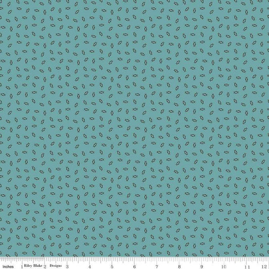 Teal fabric with small pattern.