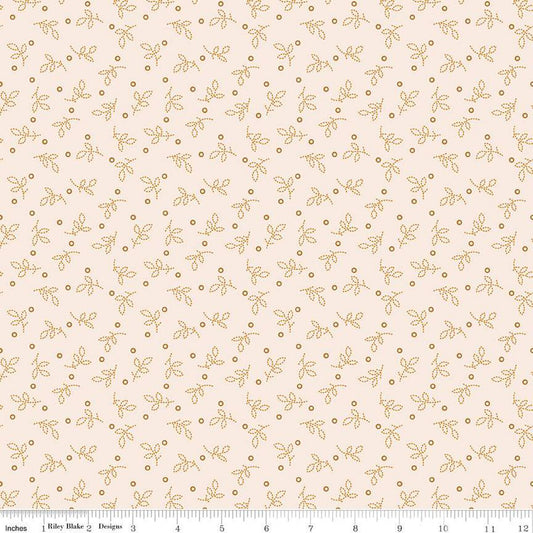 Fabric with a subtle pattern of small leaves and dots on a light pink background