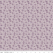 Fabric with small floral pattern on a light purple background