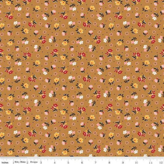 Floral pattern fabric swatch on a brown background