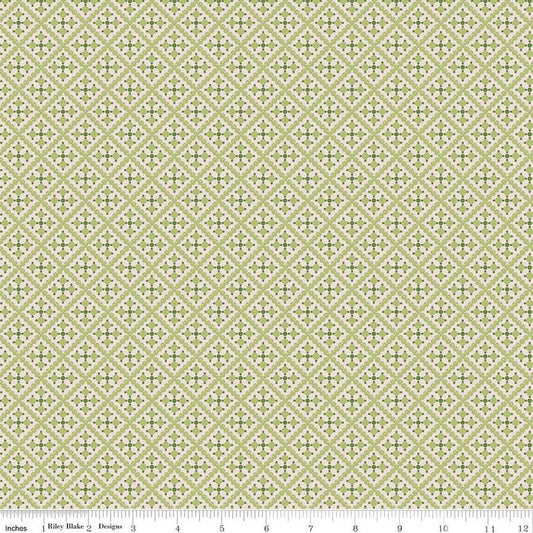 Patterned fabric with a geometric design on a light green background