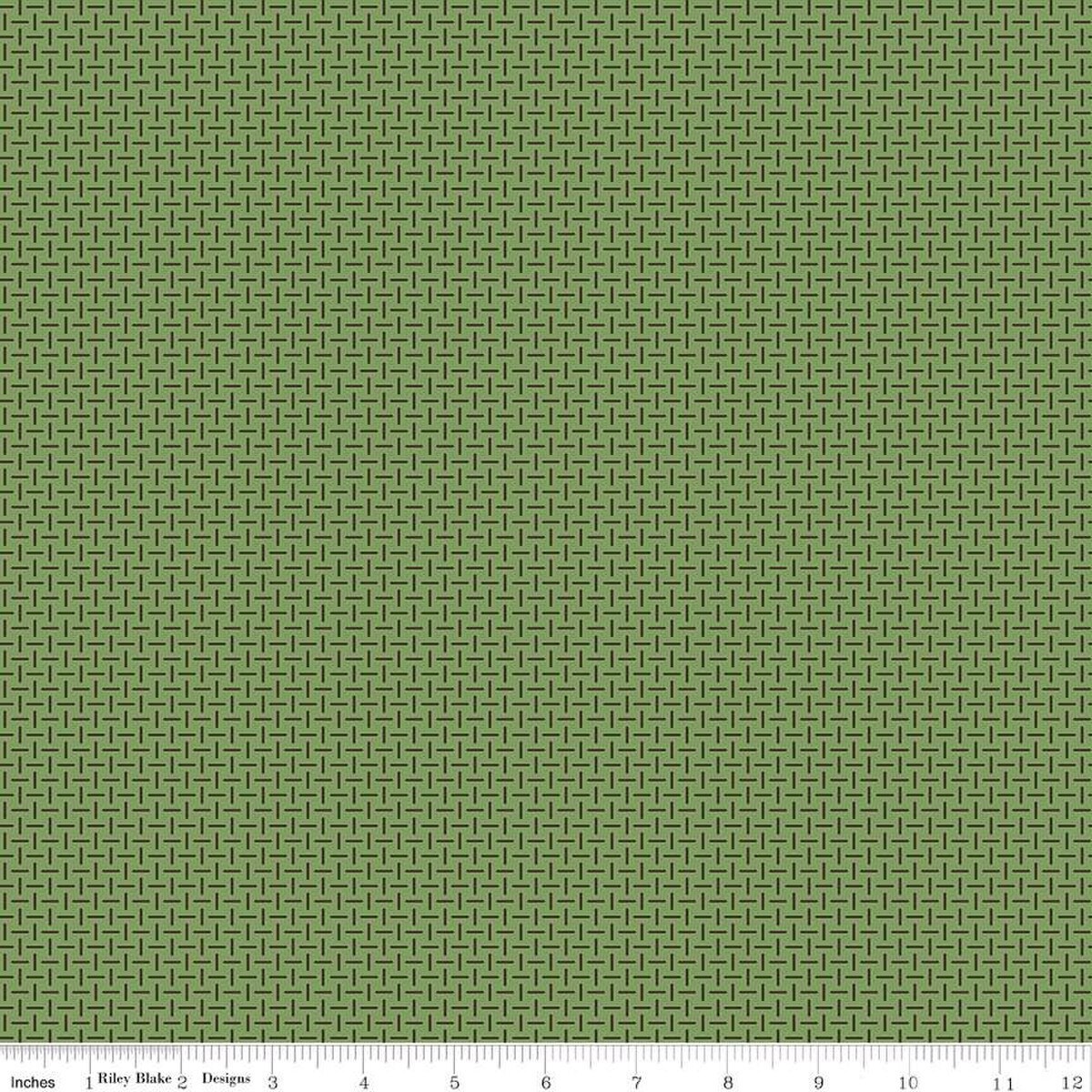 Green fabric with a subtle pattern on a green background