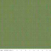 Green fabric with a subtle pattern on a green background