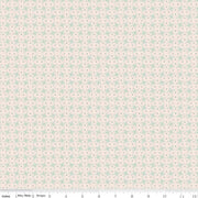 Floral patterned fabric with small green flowers on a light pink background